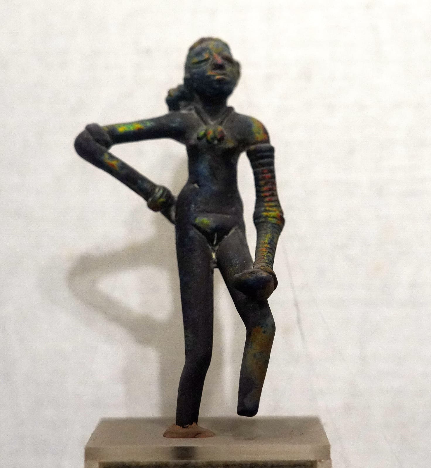 Small bronze statuette of the Indus Valley Dancing Girl at the National Museum, New Delhi