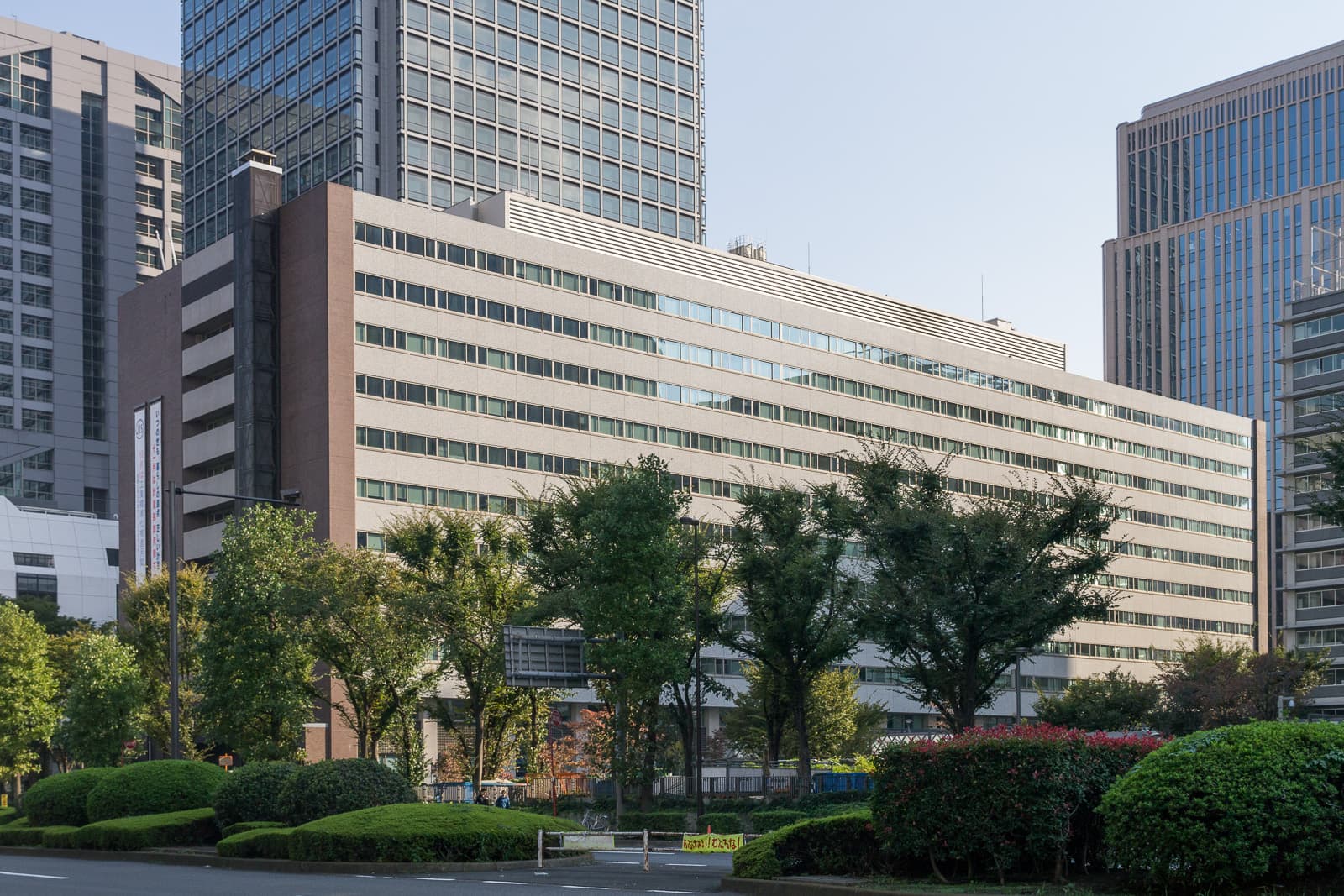 Large government office building surrounded by trees in central Tokyo
