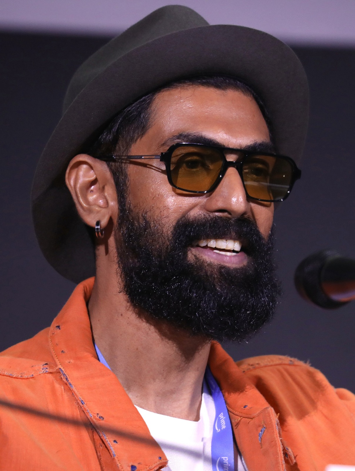 Rana Daggubati speaking into a microphone at San Diego Comic-Con