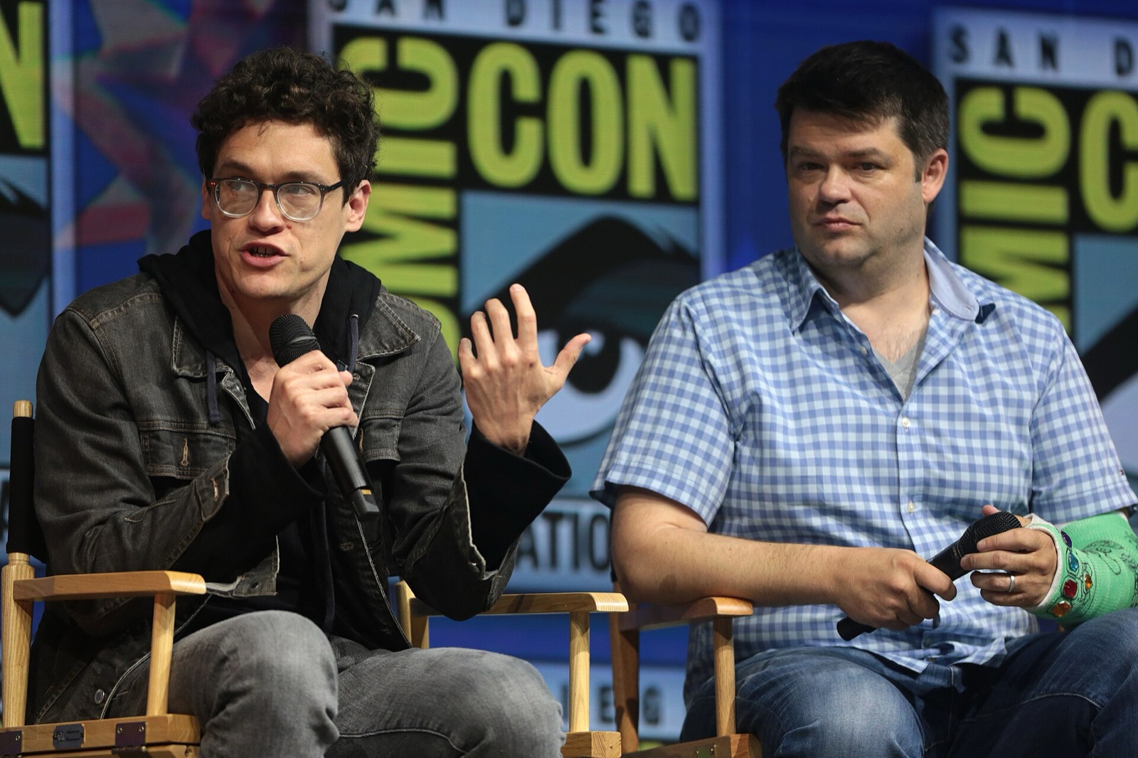 Phil Lord and Christopher Miller seated at a convention panel