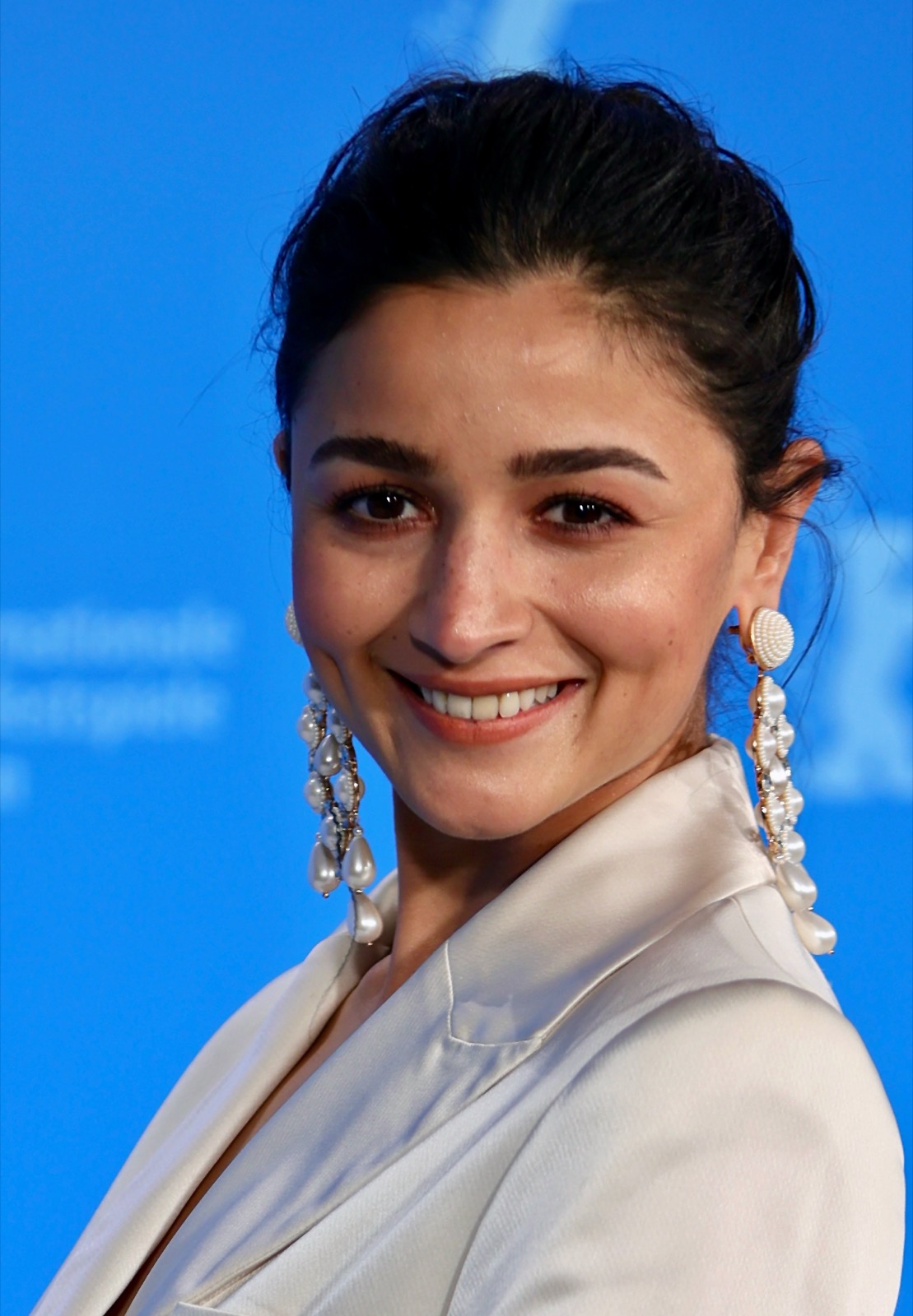 Alia Bhatt smiling at a film festival photo call
