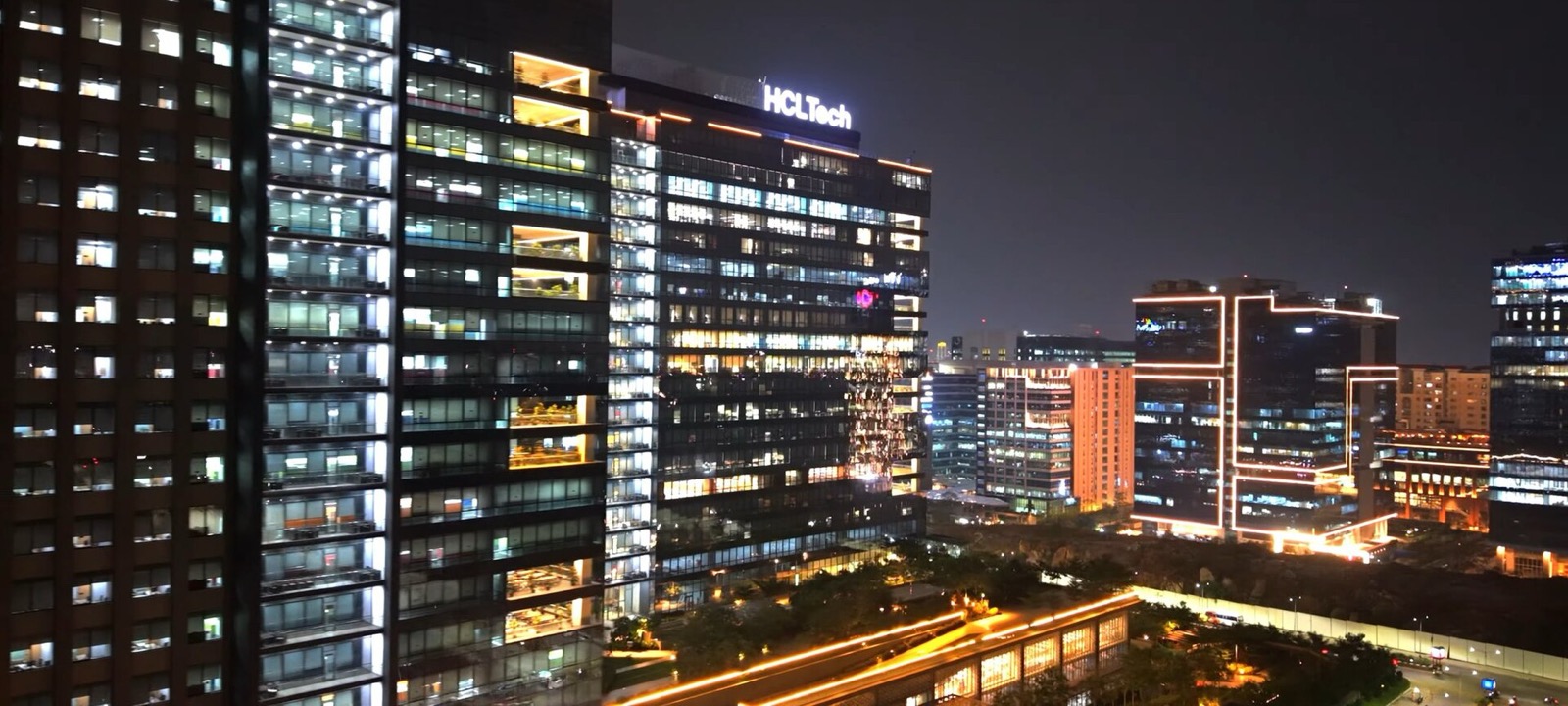Night skyline of Hyderabad HITEC City with brightly lit office towers