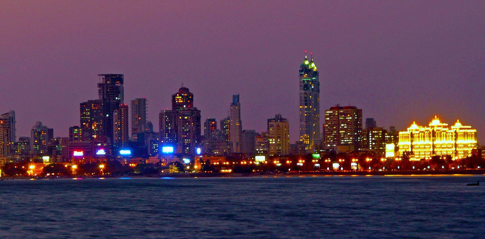 Mumbai skyline lit up at night across Back Bay