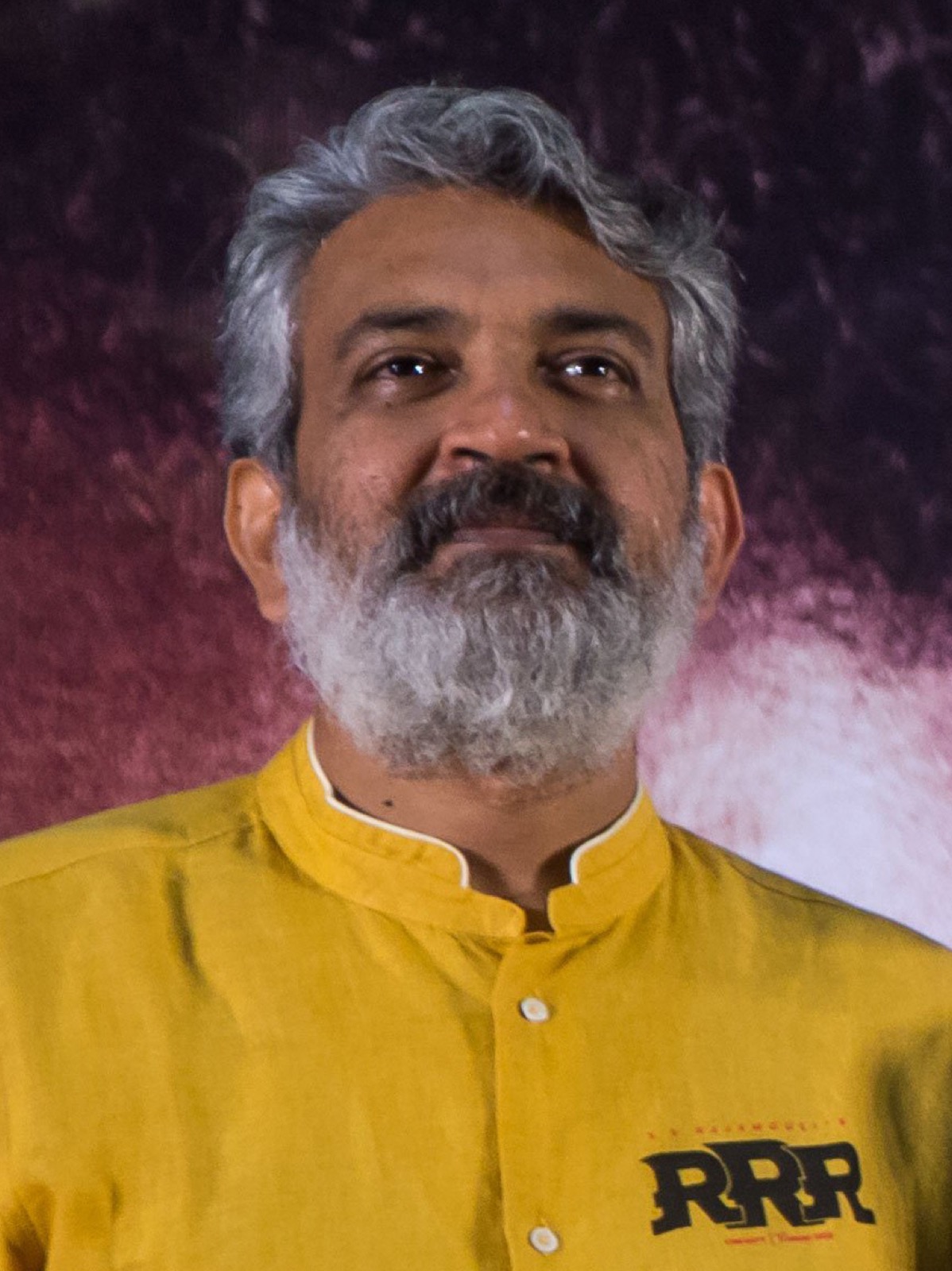 S.S. Rajamouli in a yellow kurta at a press event
