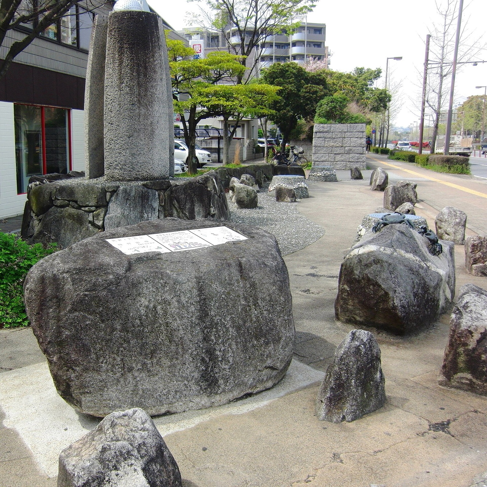 Stone monument garden on a Fukuoka sidewalk commemorating Sazae-san