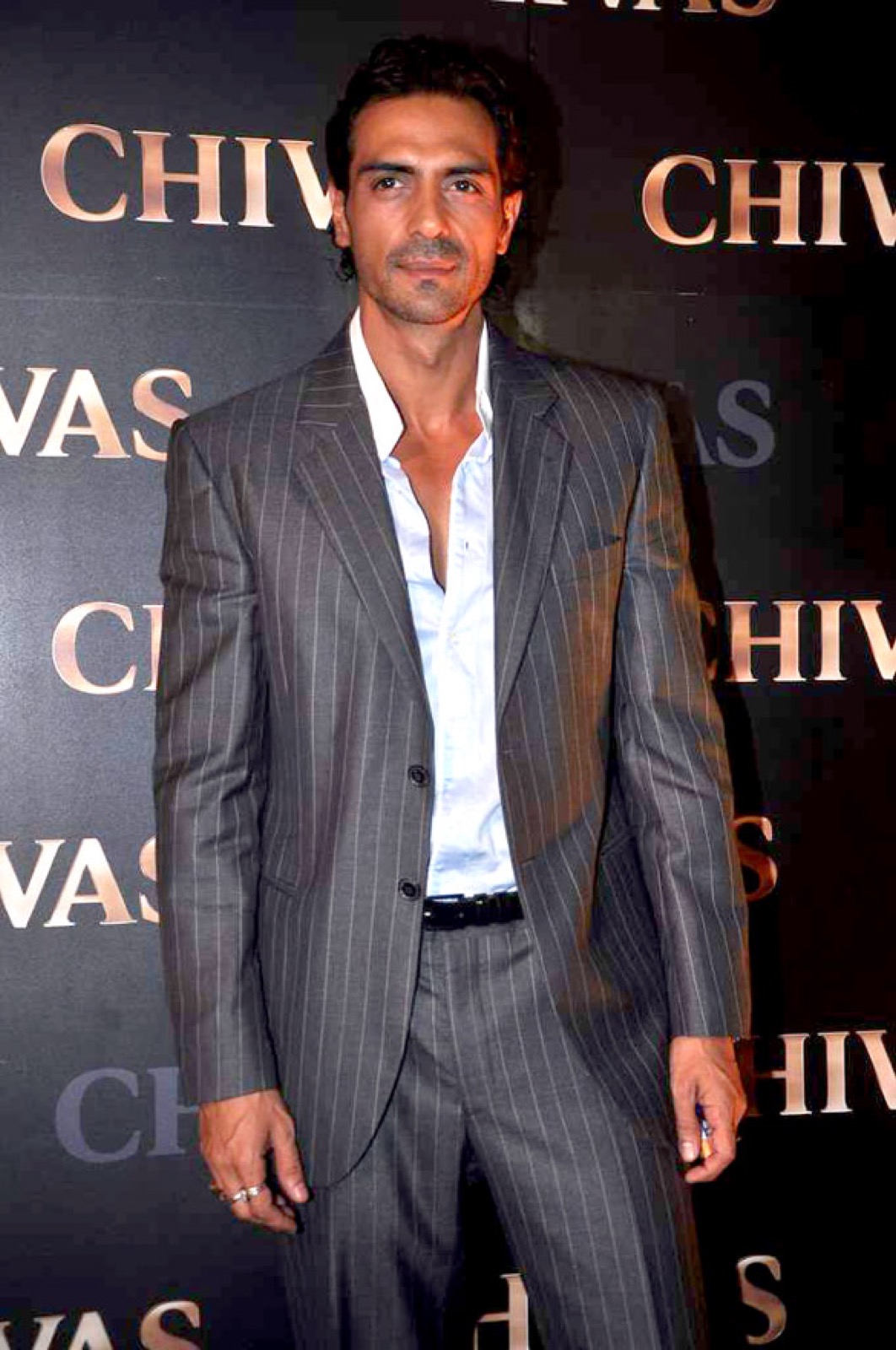 Arjun Rampal in a grey pinstripe suit at an event